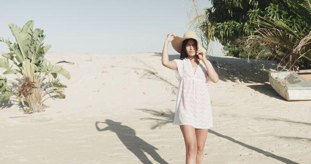 Woman Enjoying Sunny Beach in Casual Dress and Sun Hat - Download Free Stock Images Pikwizard.com