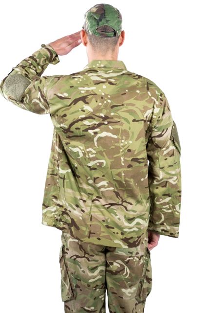 Rear view of soldier saluting on white background