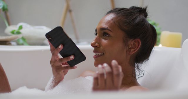 Woman Relaxing in Bubble Bath Using Smartphone for Communication - Download Free Stock Images Pikwizard.com