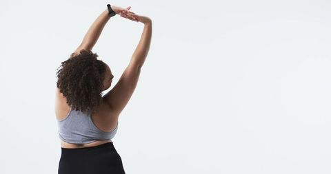 Plus Size Woman Stretching in Sportswear Embracing Body Confidence