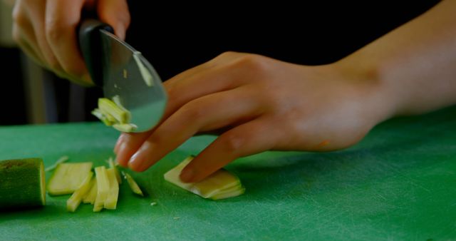 Close-up of Person Slicing Vegetables on Cutting Board - Download Free Stock Images Pikwizard.com