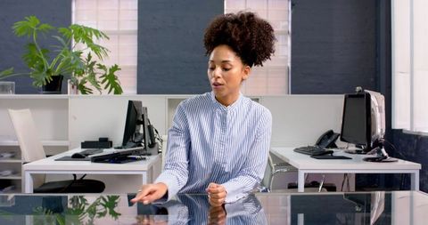 Businesswoman Contemplative in Modern Office Environment