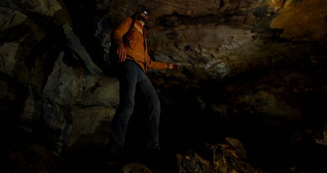 Adventurous Man Exploring Dark Cave with Headlamp - Download Free Stock Images Pikwizard.com