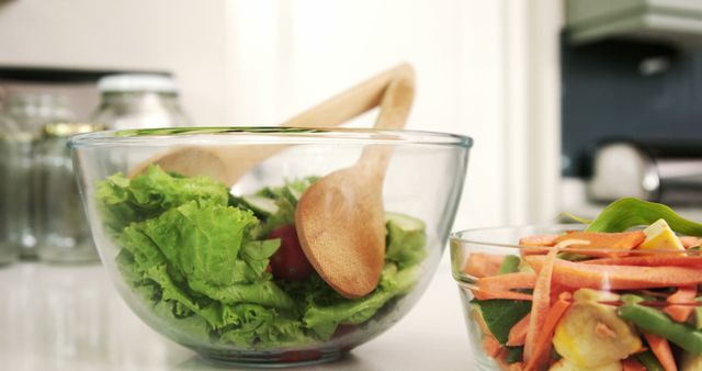 Fresh Vegetable Salad with Wooden utensils in Kitchen - Download Free Stock Images Pikwizard.com