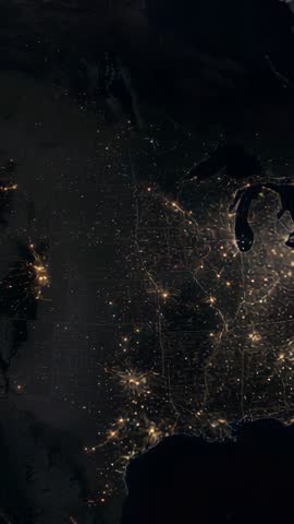 Vertical satellite video showing US nightscape with drifting clouds over Great Lakes cities