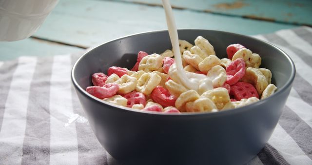 Pouring Milk into Bowl of Colorful Breakfast Cereal - Download Free Stock Images Pikwizard.com