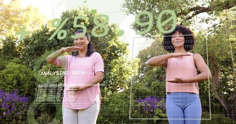 Outdoor ar wellness duo practicing holding gestures with live data overlays
