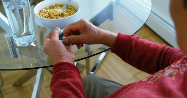 Senior Taking Medication While Having Breakfast at Home - Download Free Stock Images Pikwizard.com