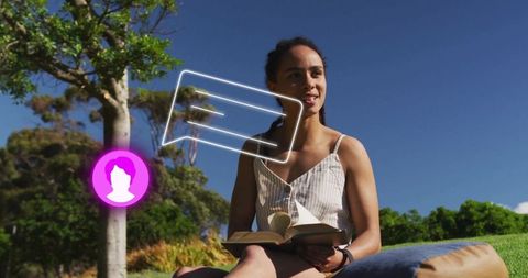 Woman reading outdoor in sundress with virtual chat concept
