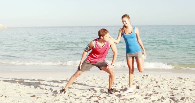 Couple Stretching on Beach for Morning Workout - Download Free Stock Images Pikwizard.com