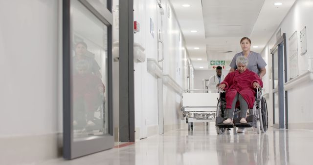 Nurse Caring for Elderly Patient in Wheelchair in Hospital Hallway - Download Free Stock Images Pikwizard.com