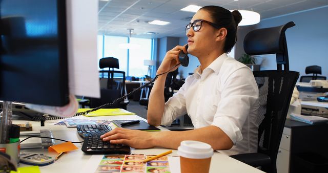 Young Professional Working in Modern Office Talking on Phone - Download Free Stock Images Pikwizard.com