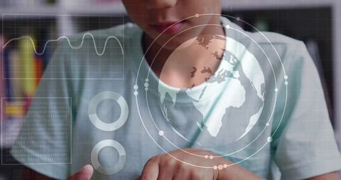 Student interacting with holographic globe and data hud while tapping tablet for learning