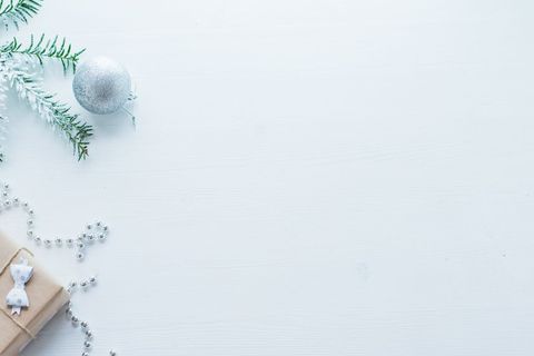 Minimalist Christmas Background with Silver Ornament and Gift