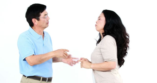 Mature Couple Resolving Disagreement Against White Background - Download Free Stock Images Pikwizard.com