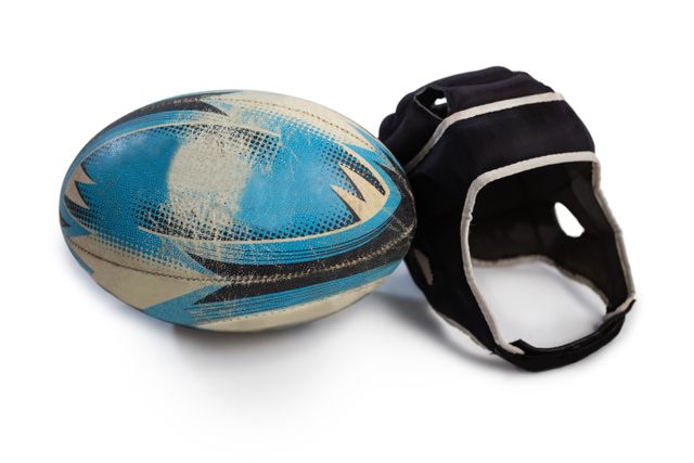 Close up of rugby ball with helmet against white background