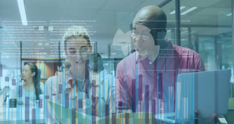 Business Colleagues Analyzing Data with Digital Graphs in Modern Office