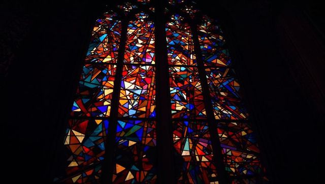 Geometric Stained Glass Illuminating Sacred Space