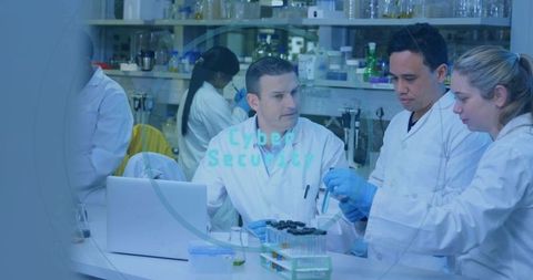 Team of Scientists Conducting Research in Modern Laboratory