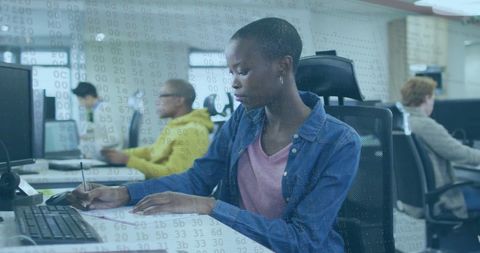 Focused Businesswoman Analyzing Financial Data in Office