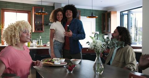 Diverse Friends Enjoying Celebration in Contemporary Kitchen