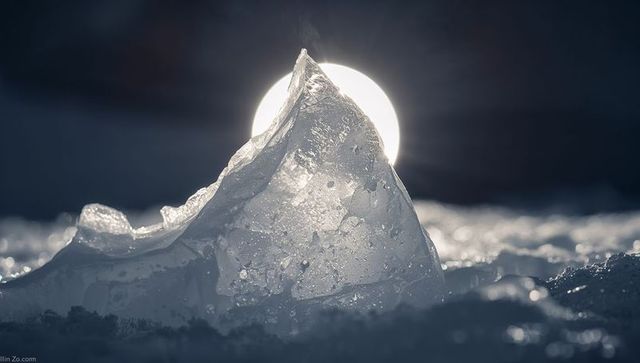 Backlit Crystal Ice Shard Under Moonlight Creating Sparkling Frosted Snow Macro