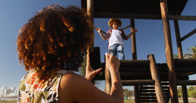 Mother Photographing Excited Child on Playground on Sunny Day - Download Free Stock Images Pikwizard.com