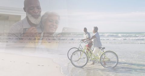 Senior Couple Enjoying Technology and Beachside Bike Ride