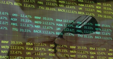 Hand Holding Smartphone with Stock Ticker Overlay