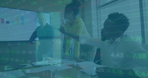 Diverse coworkers analyzing financial data projections in office