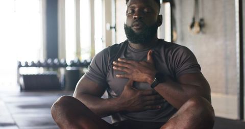 Man Meditating in Gym for Mindfulness and Strength