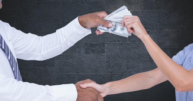 Digital composite of Cropped image of business people's hands holding money representing corruption concept