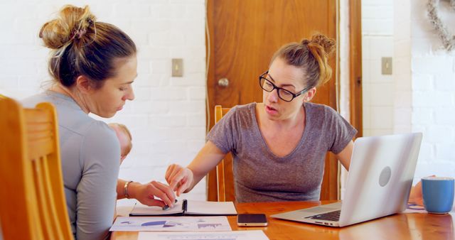 Two Women Collaborating on Work Projects at Home - Download Free Stock Images Pikwizard.com