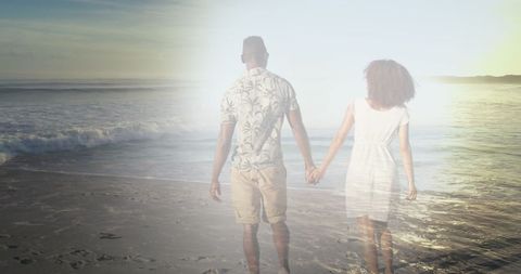 Romantic African American Couple Holding Hands at Sunset Beach - Download Free Stock Images Pikwizard.com