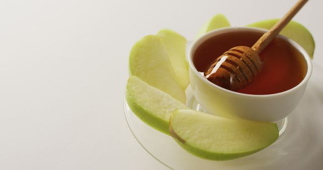 Image of honey in jar and apple slices lying on white surface. food, cooking, baking, taste and flavour concept.