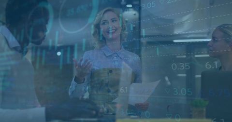 Diverse business people discuss global financial data in modern office