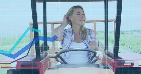 Confident farmer driving tractor with digital graph overlay