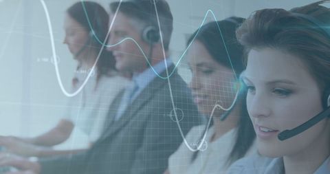 Multinational team utilizing financial technology and headsets