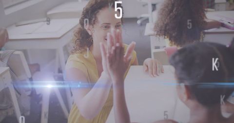 Excited Teacher High-Fiving Student in Modern Classroom