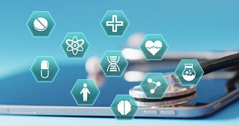Medical Icons Floating Above Tablet With Stethoscope