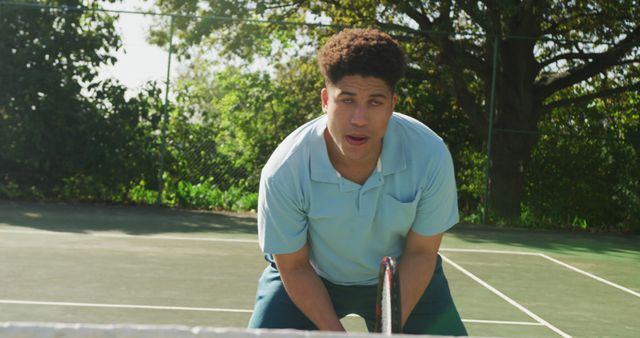 Image of happy biracial man playing tennis on the court - Download Free Stock Photos Pikwizard.com