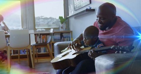 Father and Son Bonding with Guitar in Cozy Living Room Setting