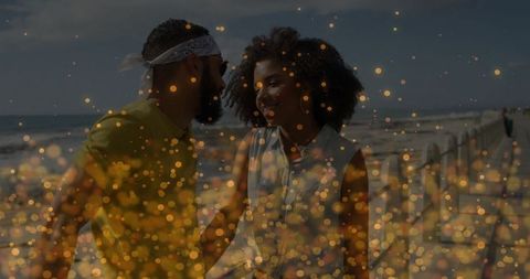 Smiling Couple Enjoying Romantic Beachside Stroll at Golden Hour