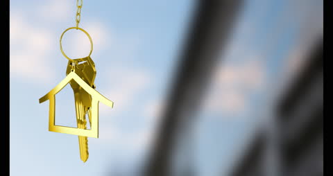 Key with House Keychain Symbolizing Home Ownership