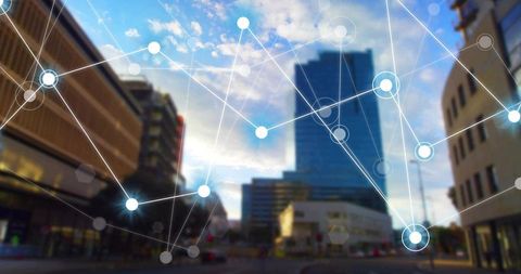 Smart city network overlay on blurred urban skyscraper conveying connectivity and iot