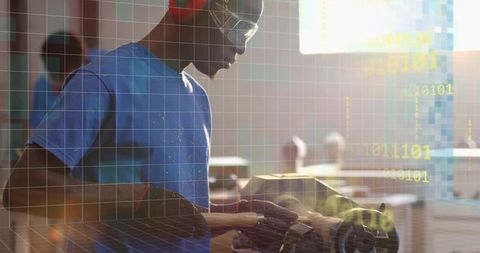 Male woodworker shaping wooden bowl on lathe wearing safety goggles and ear protection