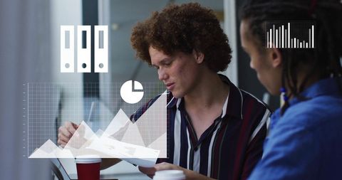 Diverse Colleagues Analyzing Data with Digital Overlay at Office