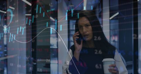 businesswoman on phone analyzing financial graphs - Download Free Stock Images Pikwizard.com