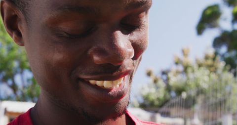 Man Enjoying Sunny Day with Happy Dogs at Animal Shelter