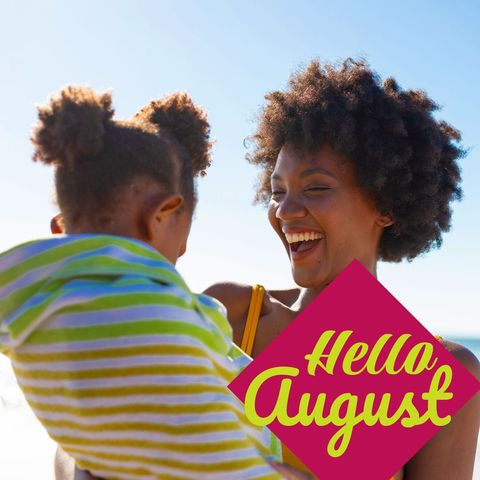 Joyful mother and daughter on bright summer beach